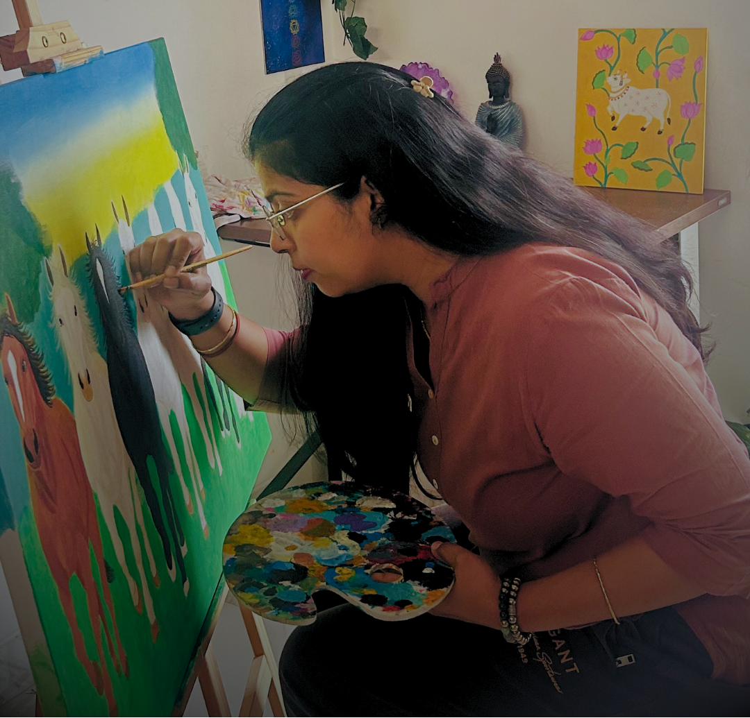 Woman painting a colorful scene with various artworks on the wall in the background.