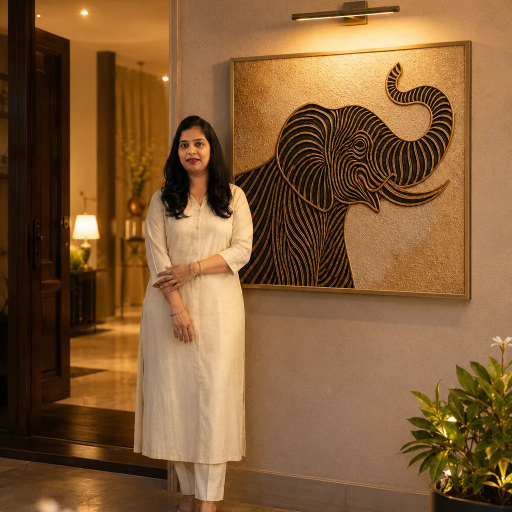 Woman standing in a room with a large framed elephant artwork on the wall.