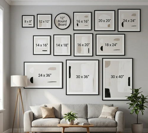Living room with gray sofa, decorative plants, and wall art displaying frame sizes.